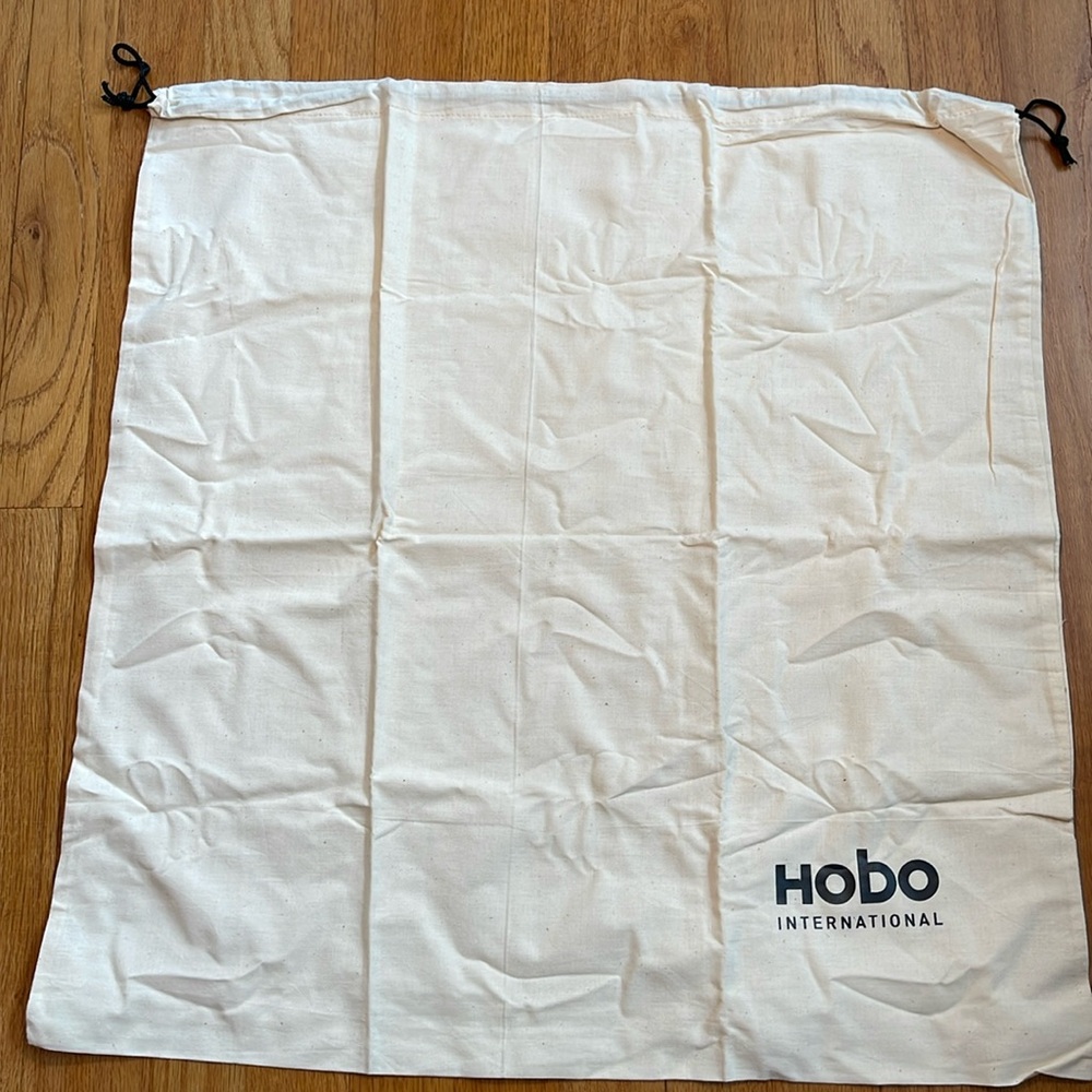 HOBO International dust bag. 23”x24”. Cream with black accents. Drawstring.